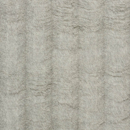 Beige-gray textured rug with plush low-pile and subtle wavy pattern.