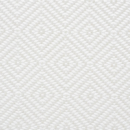 Cream quilted fabric with a diamond lattice and circular medallion motifs; soft textured upholstery or bedding material.