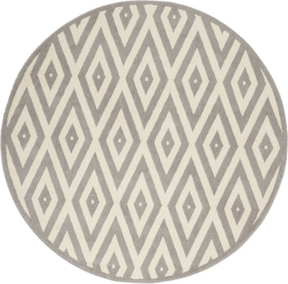 Round rug featuring a gray and ivory diamond lattice geometric pattern.