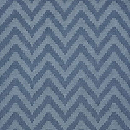 Indigo patterned woven fabric swatch with a solid light-blue area on a blue chevron backdrop; smooth rectangular piece.