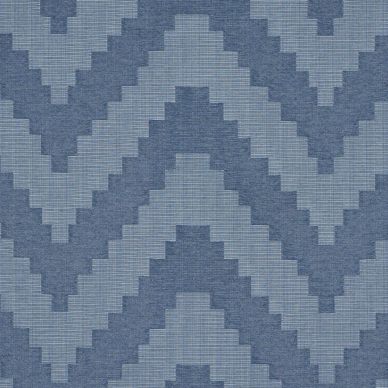 Blue chevron-diamond woven pattern fabric in light and dark blues; geometric textile for upholstery or wallpaper.