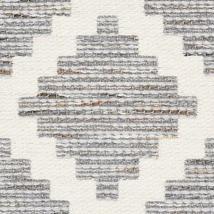 Grey woven rug with geometric diamond pattern; textured, contemporary tribal style.