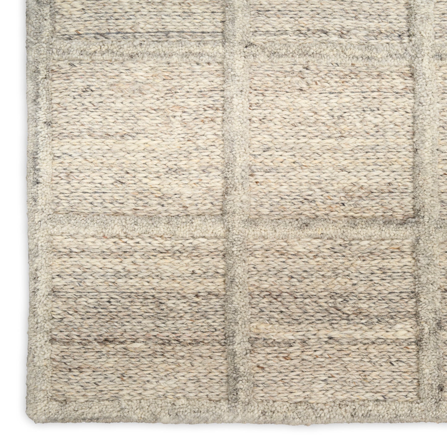 Beige woven rug with rectangular panel grid, loop pile texture in natural fibers; neutral, versatile living-room style.