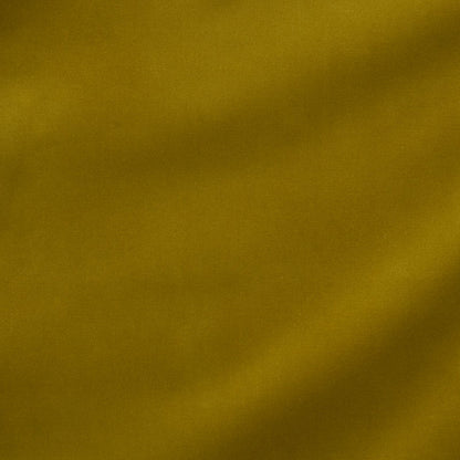Mustard yellow fabric texture with subtle diagonal shading, a warm backdrop for product photography.