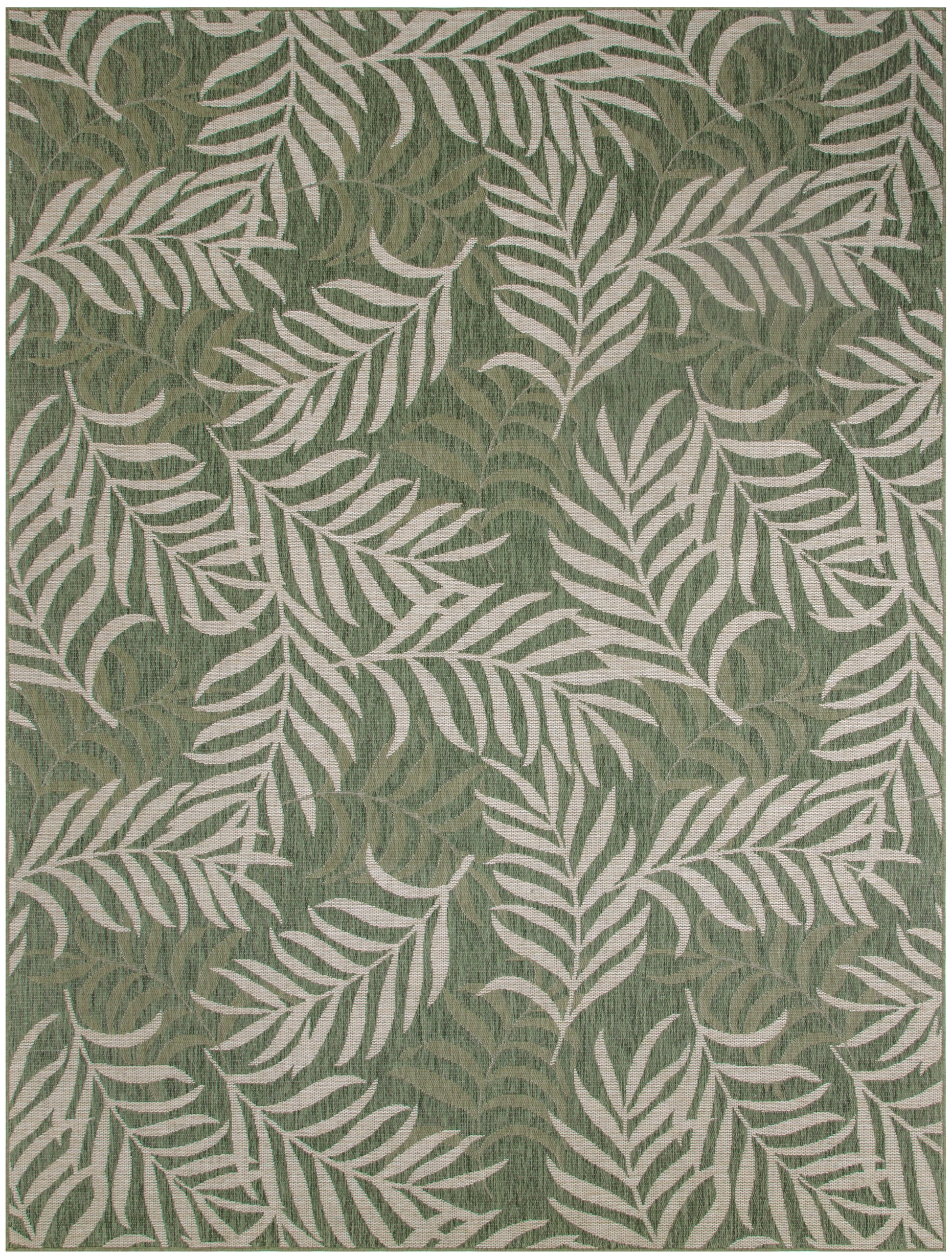Green rug with cream palm leaf pattern; botanical, tropical-inspired decor.
