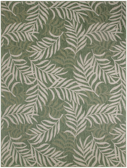 Green rug with cream palm leaf pattern; botanical, tropical-inspired decor.