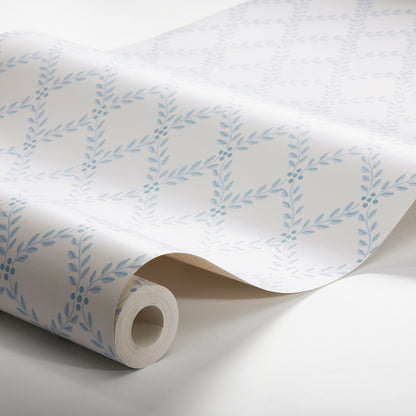 Rolled white wallpaper with pale blue laurel leaf pattern on diagonal vines; decorative botanical design.
