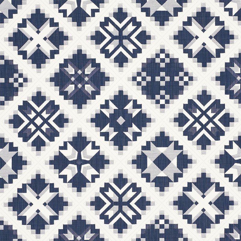 Navy blue & white geometric tile pattern with diamonds, crosses & star motifs in a repeating grid.