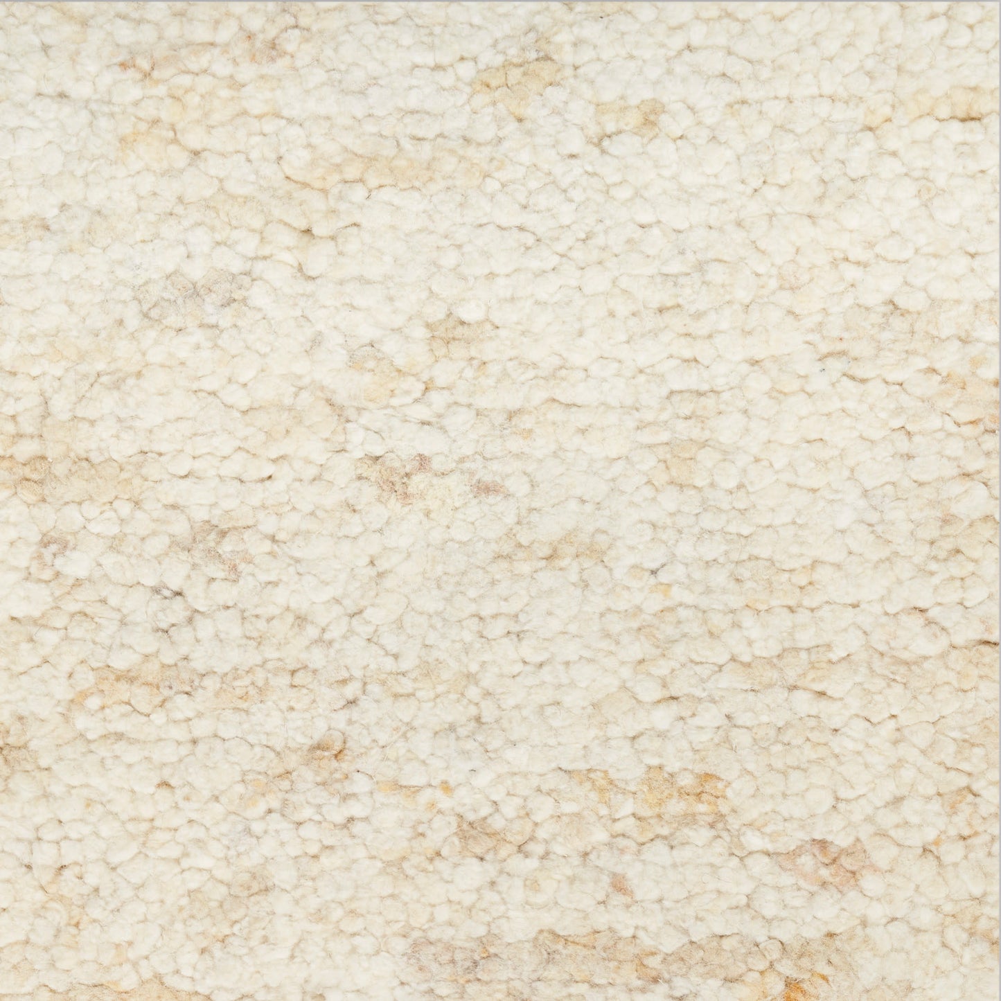Creamy beige textured rug with a subtle knobby surface and tiny rounded granules.