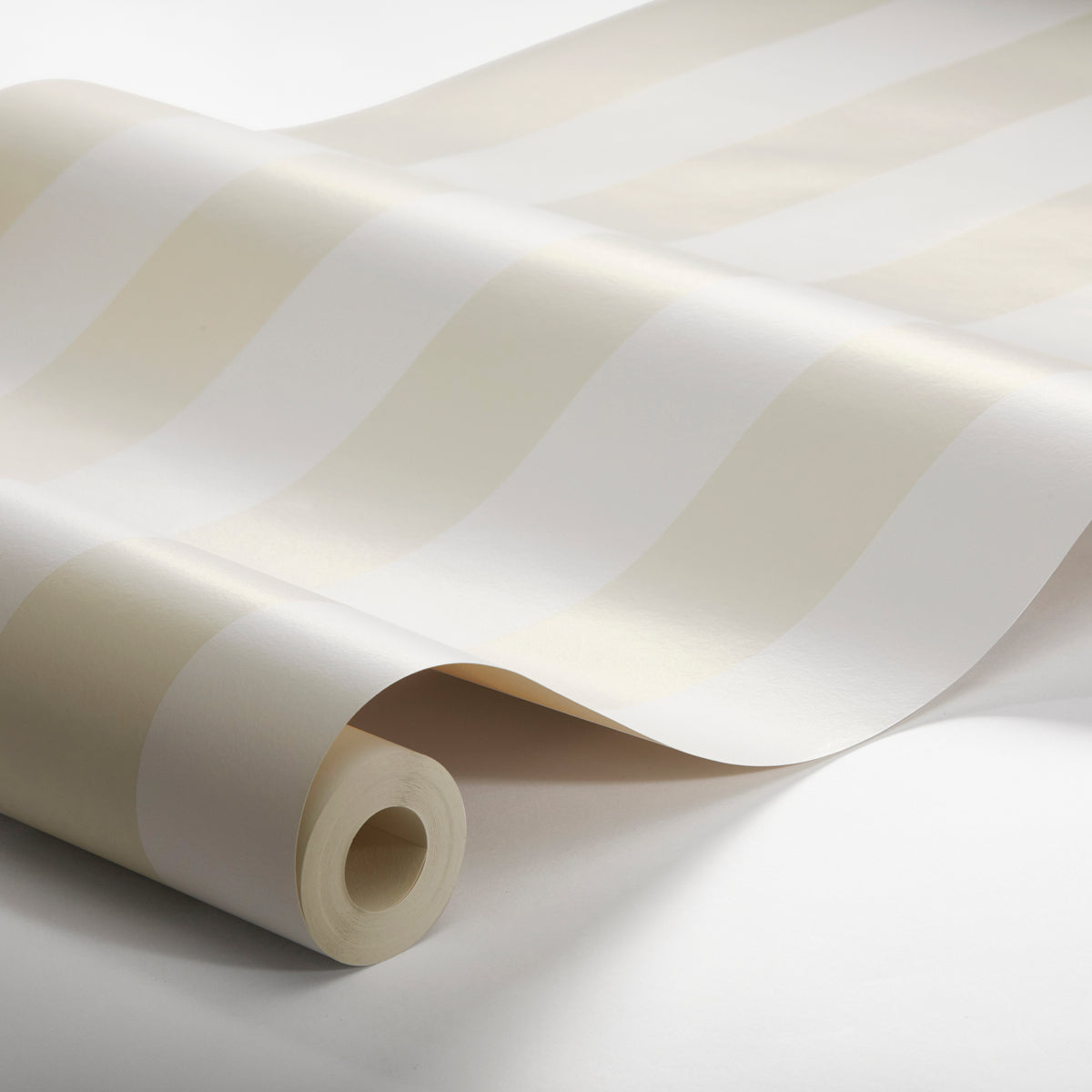Cream and white striped wallpaper roll with a smooth vinyl finish, partially unrolled.