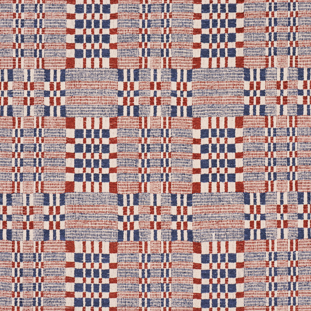 Beige woven fabric with red and navy plaid/checkered blocks, square-grid pattern; upholstery or drapery textile.