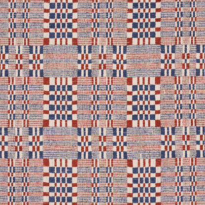Beige woven fabric with red and navy plaid/checkered blocks, square-grid pattern; upholstery or drapery textile.