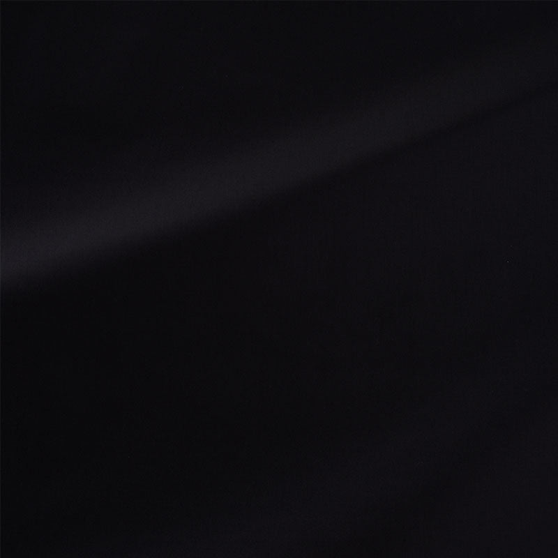 Black fabric with subtle diagonal light sheen across the surface.