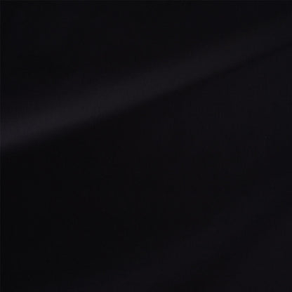 Black fabric with subtle diagonal light sheen across the surface.