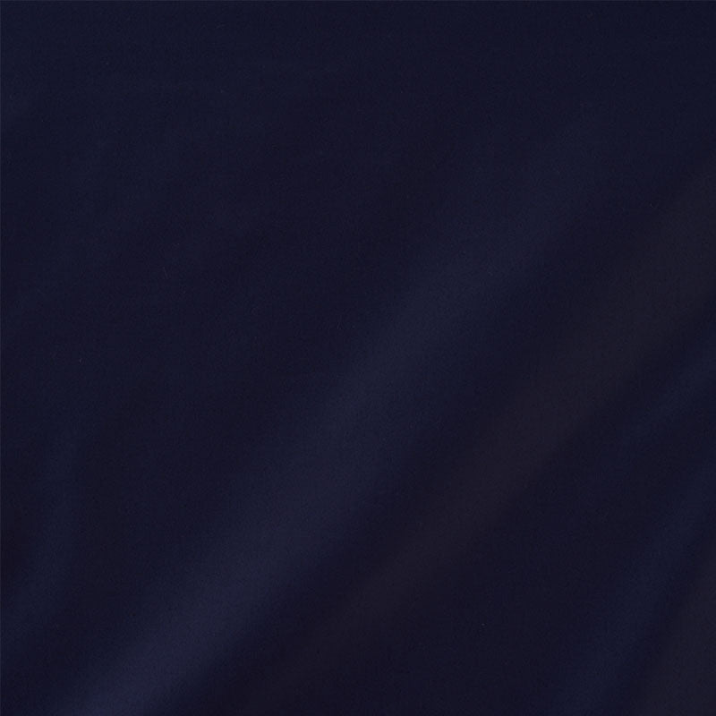 Dark navy blue fabric with subtle diagonal folds; smooth textile for apparel or home decor.