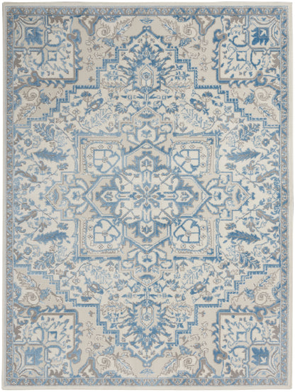 Blue & cream ornate area rug with central medallion and intricate floral border; traditional Persian-inspired design.