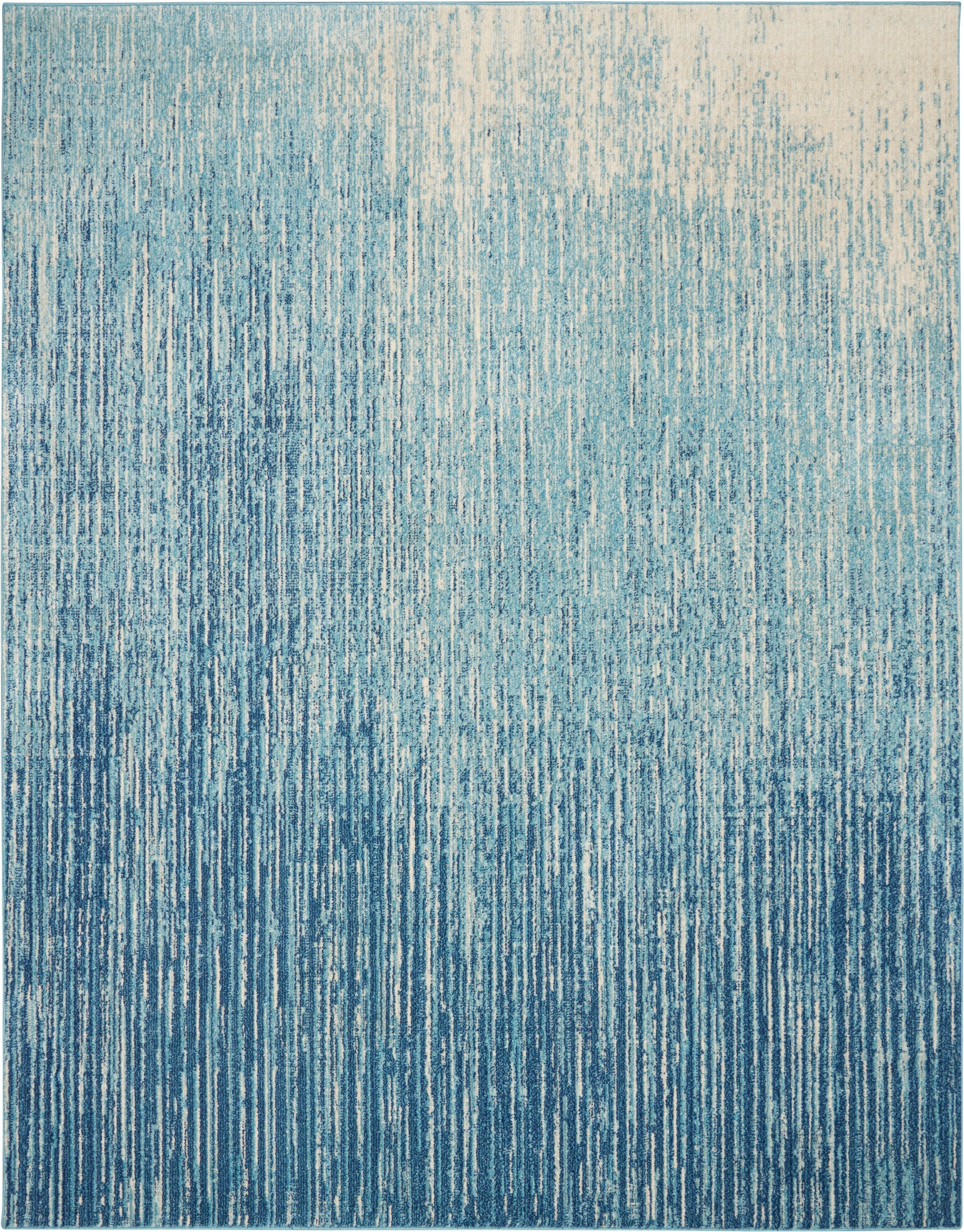 Blue textured area rug with vertical white and blue streaks, gradient from light at top to deep teal at bottom.