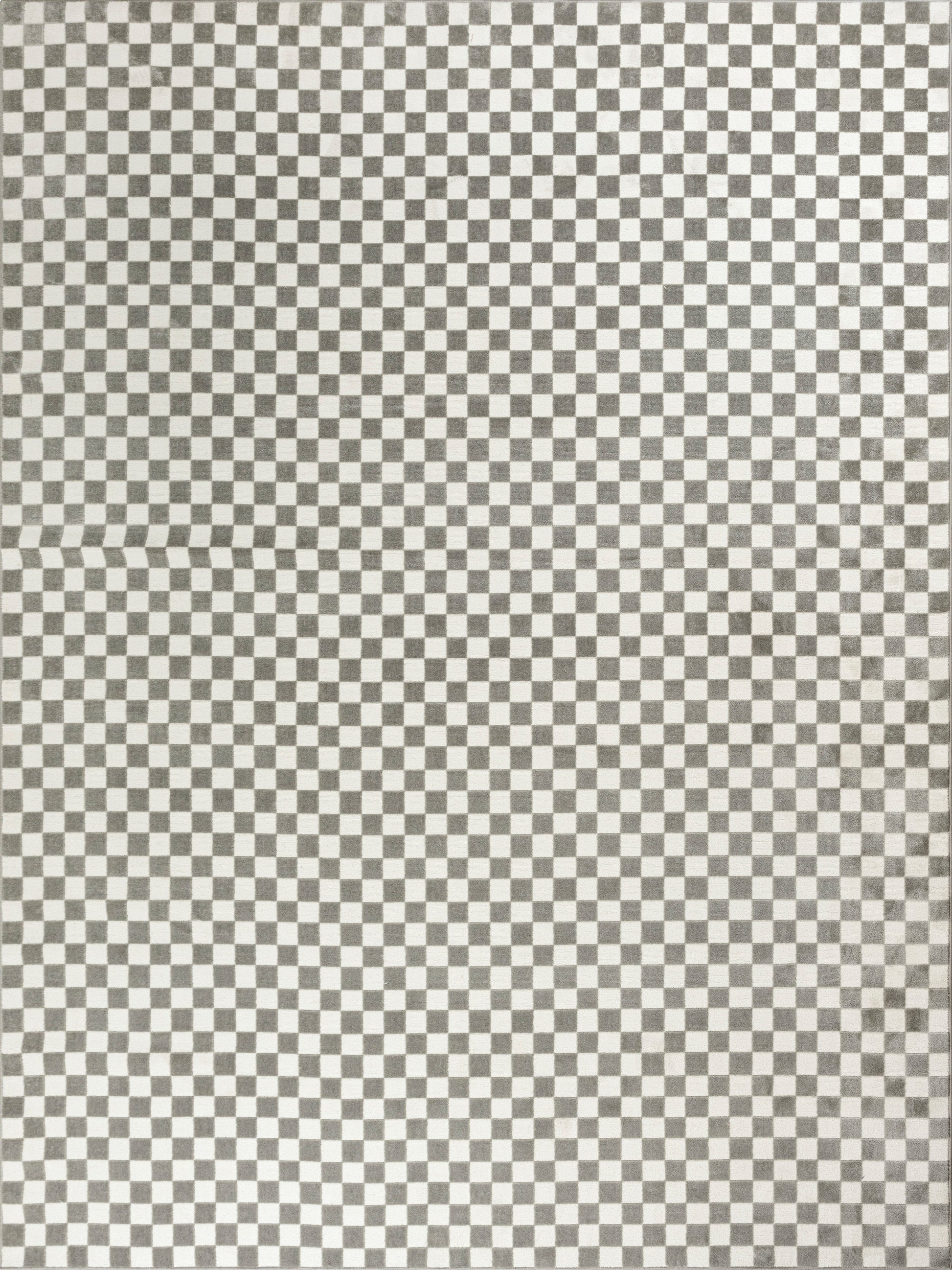 Monochrome checkerboard rug pattern of small black and white squares.
