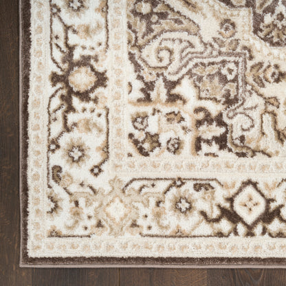 Traditional beige and ivory oriental rug with brown floral border and ornate pattern, rectangular and plush on dark wood floor.