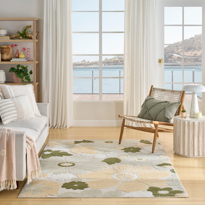 Coastal living room with pale sofa, wooden shelving, floral rug, wicker chair, round side table, and ocean-view windows.