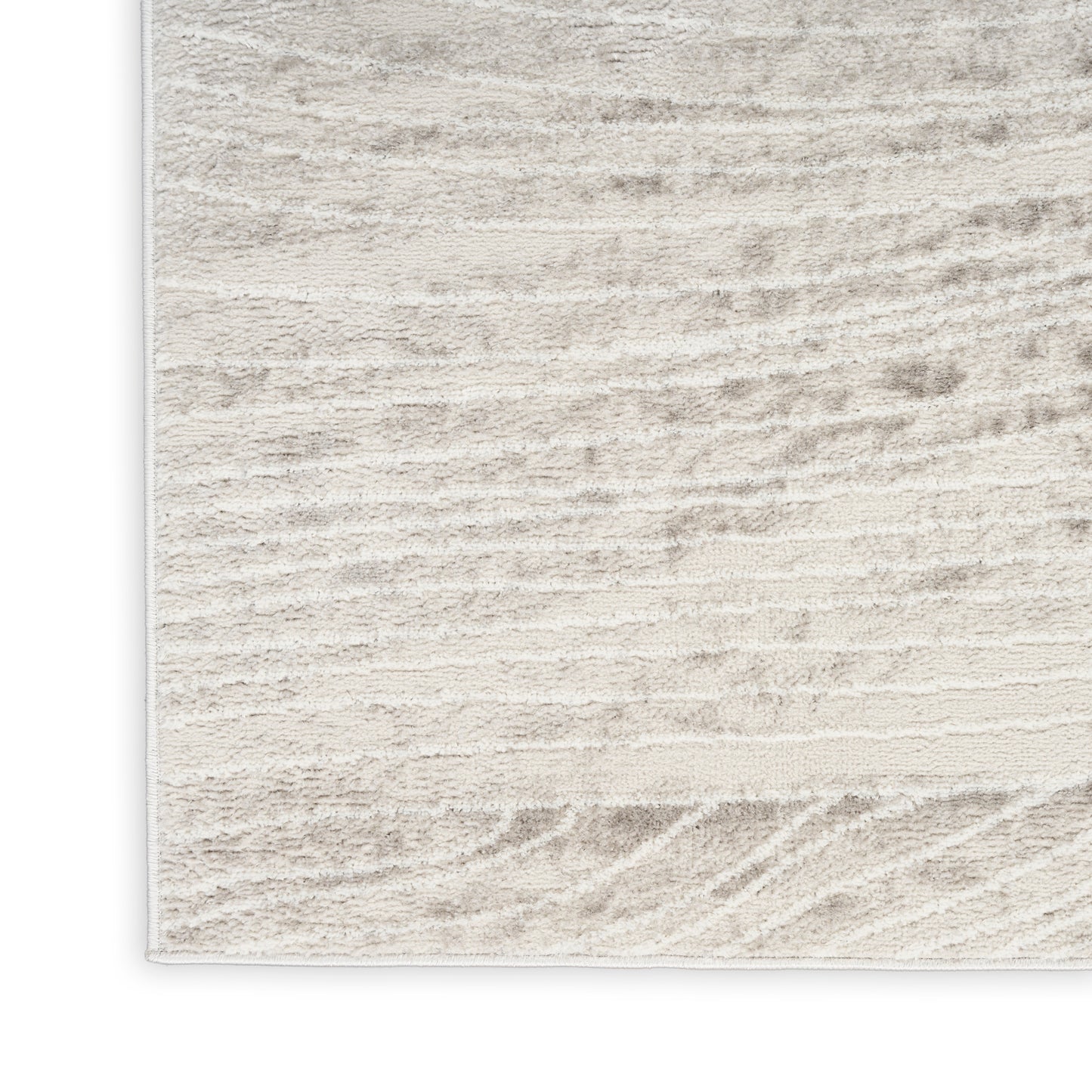 Beige cream area rug with subtle striped texture and soft plush pile for contemporary living rooms.