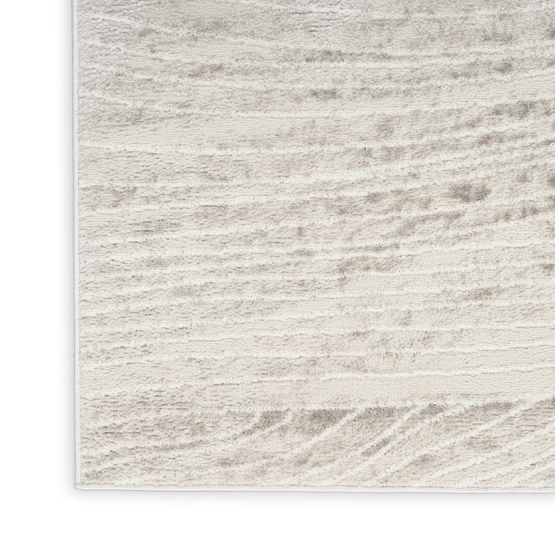 Beige cream area rug with subtle striped texture and soft plush pile for contemporary living rooms.