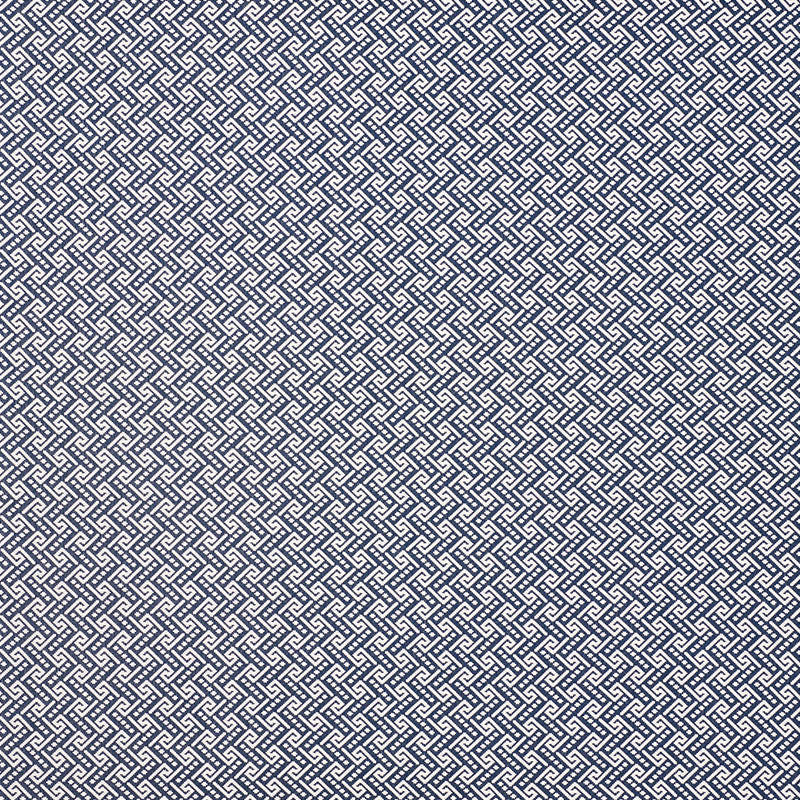 Navy blue and white interlocking geometric lattice pattern, dense woven fabric texture suitable for upholstery or apparel.
