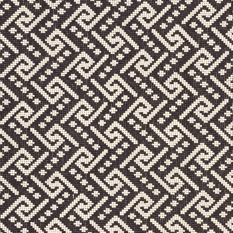 Taupe rectangular textile with a black-and-white geometric woven border along the edges; decorative rug or throw.