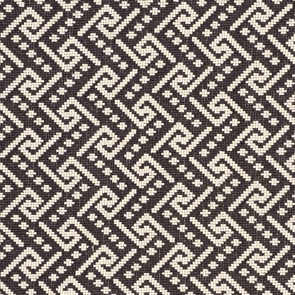 Taupe rectangular textile with a black-and-white geometric woven border along the edges; decorative rug or throw.