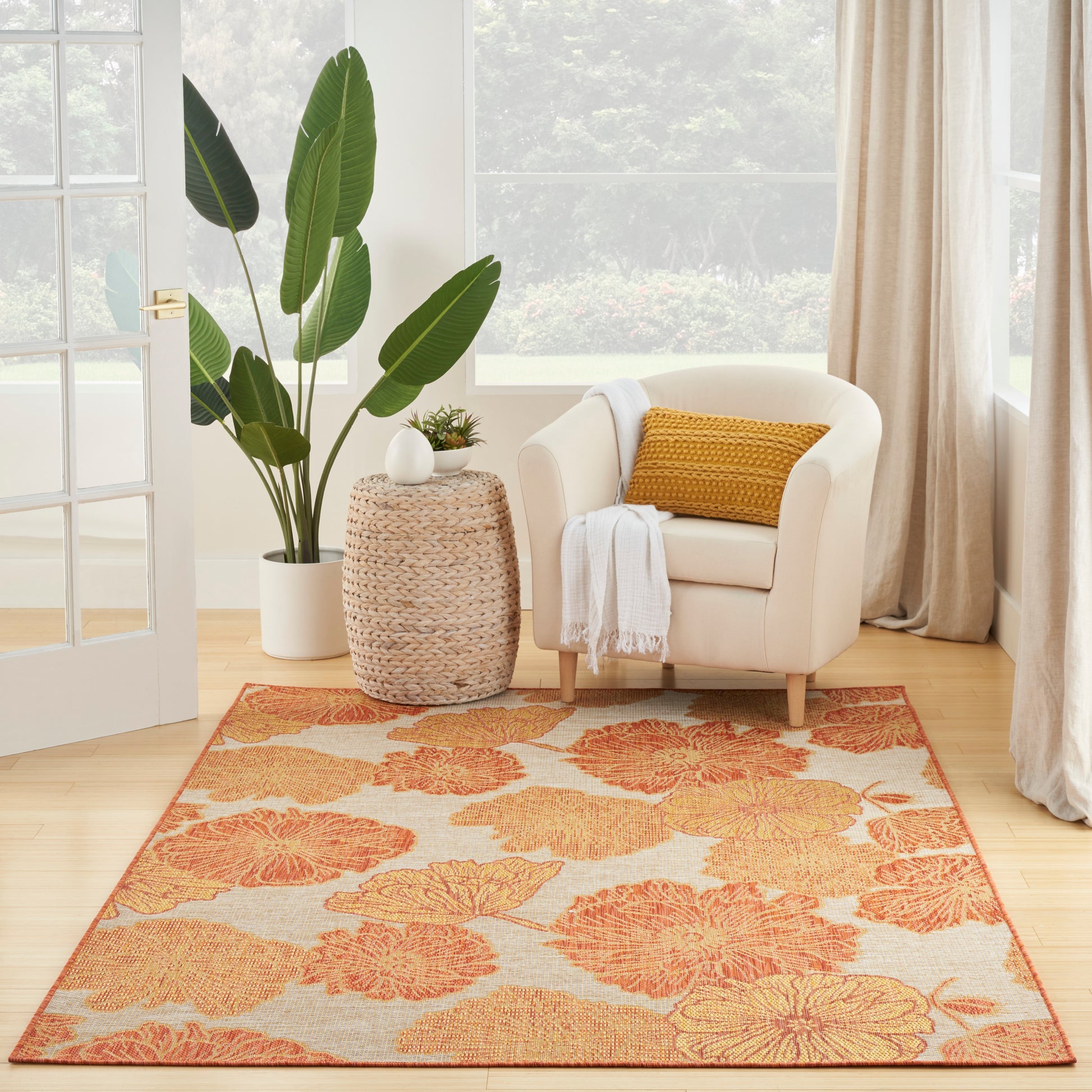 Orange floral tropical rug, 6' x 9'.