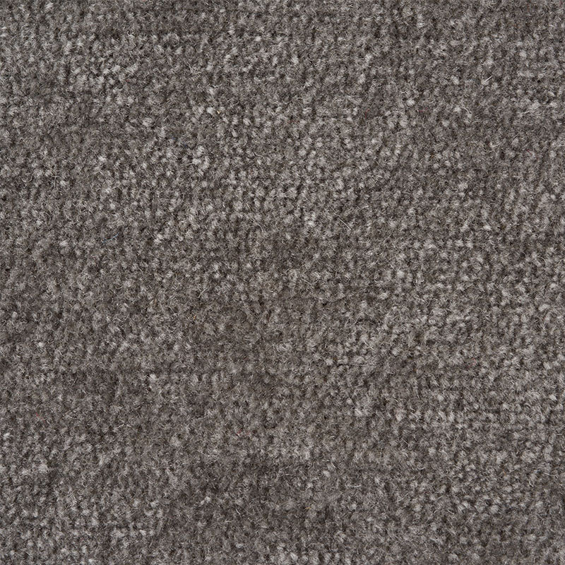 Dark charcoal boucle fabric close-up with speckled soft pile, upholstery textile.