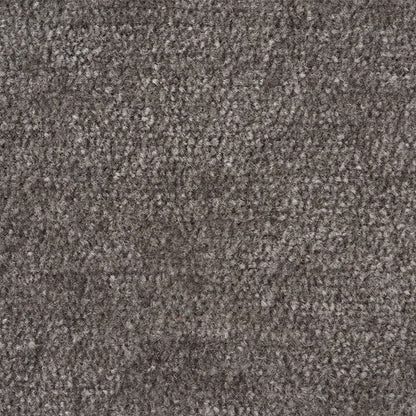 Dark charcoal boucle fabric close-up with speckled soft pile, upholstery textile.