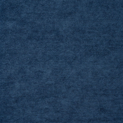 Dark indigo chenille fabric texture with soft pile for apparel or upholstery.