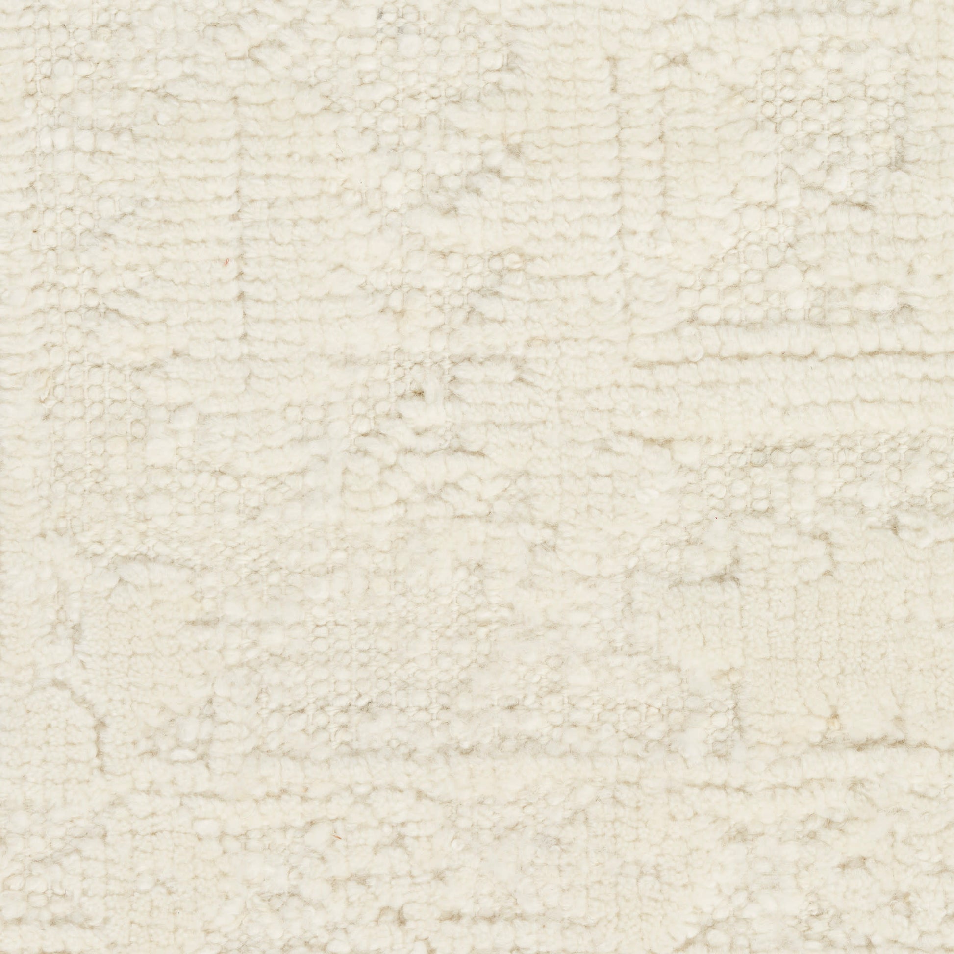 Cream tufted rug with soft loopy pile and geometric rectangular pattern; plush, cozy home decor.