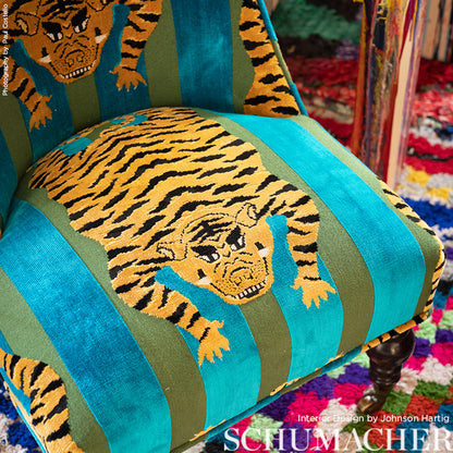 Tiger-print velvet fabric in teal, turquoise and olive green.