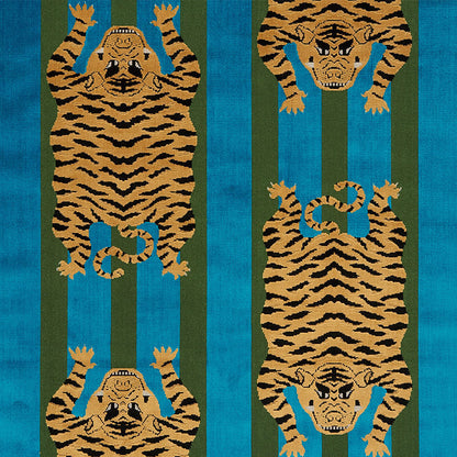 Decorative textile featuring repeating orange tiger silhouettes with black stripes against teal and olive vertical stripes.