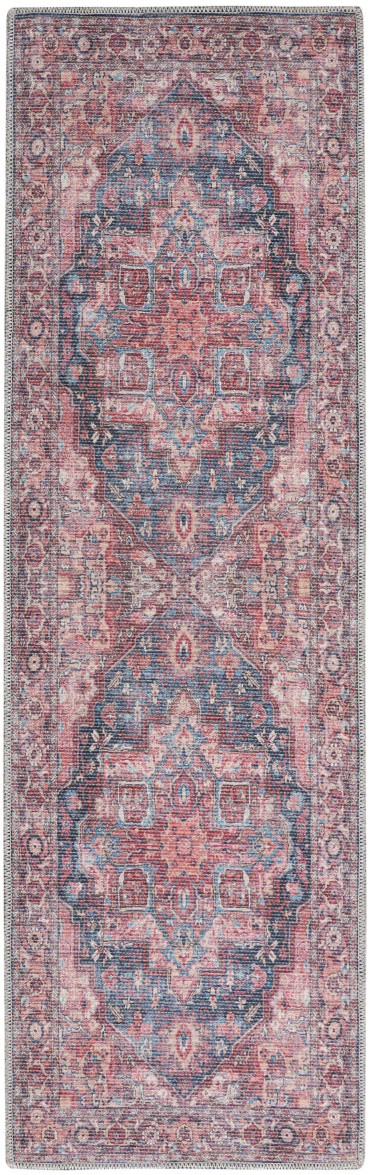Long rectangular oriental rug in pink and blue with a detailed central medallion and ornate border.