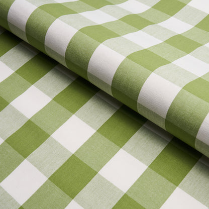 Green and white gingham cotton fabric rolled, checkered pattern, ideal for tablecloths, sewing and crafts.