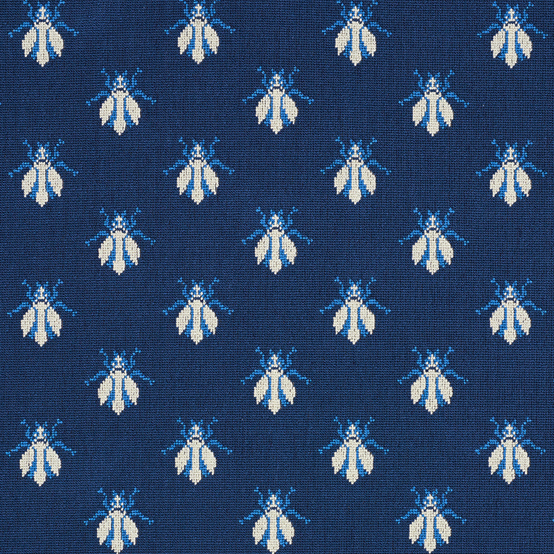 Navy blue textile with small white and light-blue bees repeating; vintage woven pattern for upholstery or apparel.