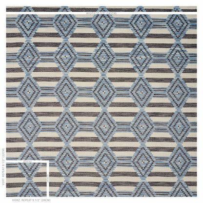 Blue diamond lattice rug on beige striped ground; woven geometric pattern in cool blues.