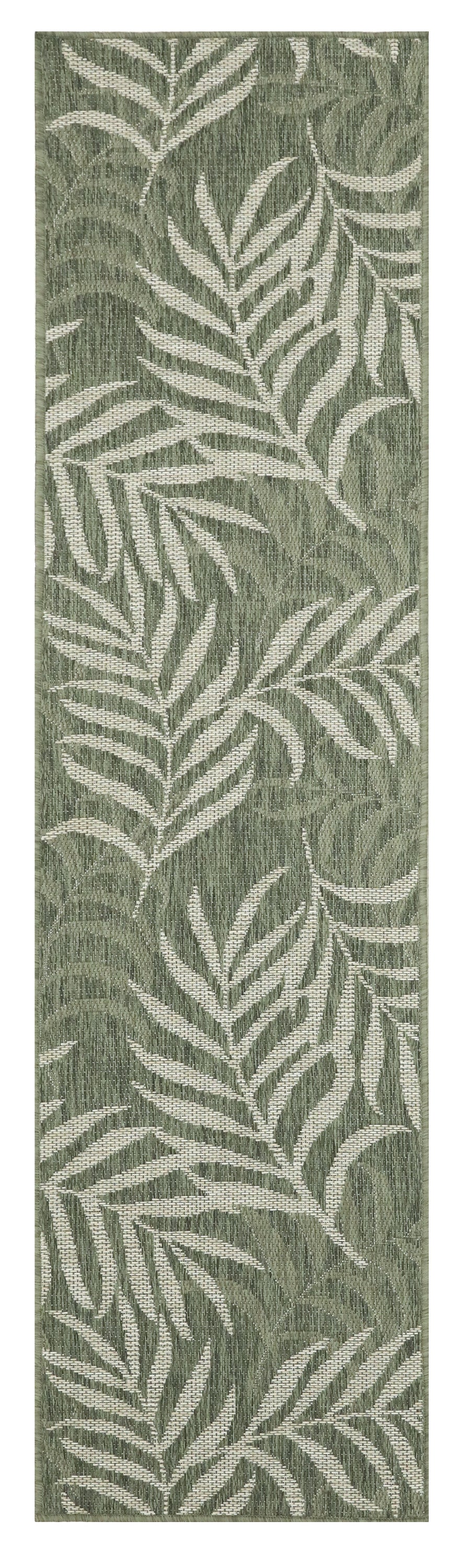 Green runner rug with white fern-like leaf pattern; woven texture, botanical home decor.