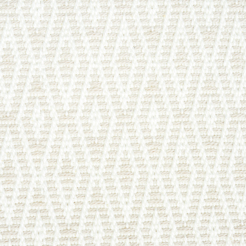Ivory woven fabric with a raised diamond lattice pattern; soft, textured textile for throws or cushions.