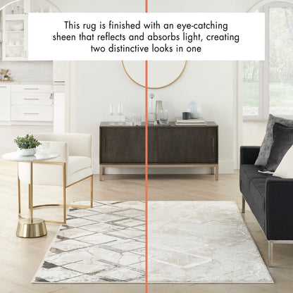 Rectangular living room rug with a two-tone grey-to-ivory geometric pattern and a reflective sheen.