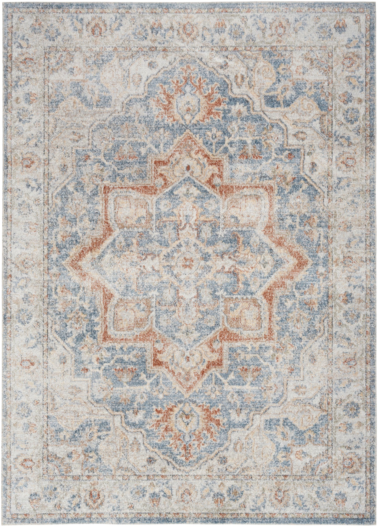 Muted blue, ivory, and coral oriental-style area rug with a central floral medallion and faded border.
