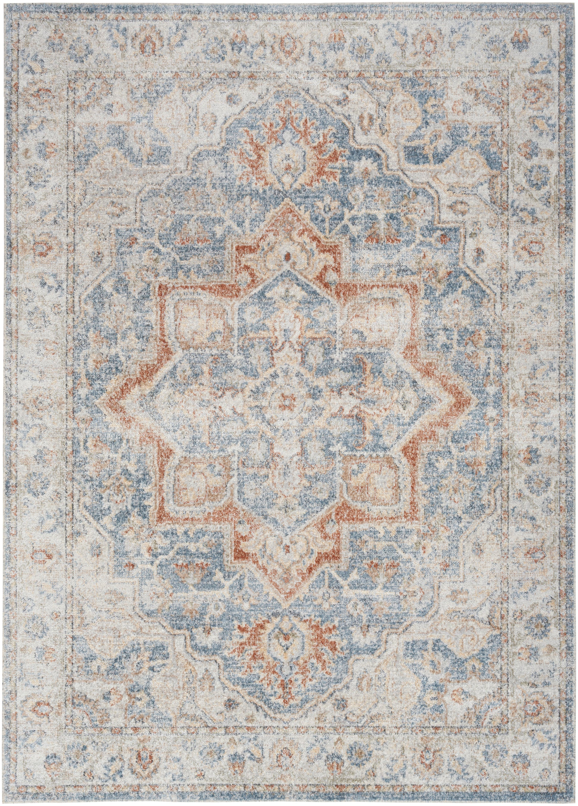 Muted blue, ivory, and coral oriental-style area rug with a central floral medallion and faded border.