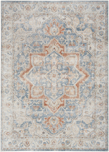Muted blue, ivory, and coral oriental-style area rug with a central floral medallion and faded border.