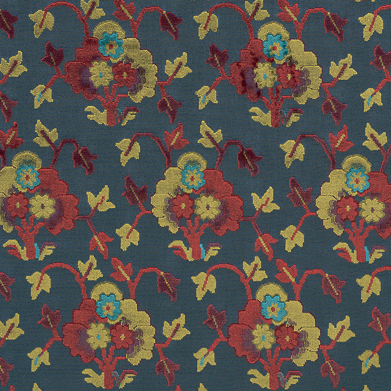 Navy blue velvet fabric with a damask-style floral pattern featuring red, yellow, teal flowers and green leaves.