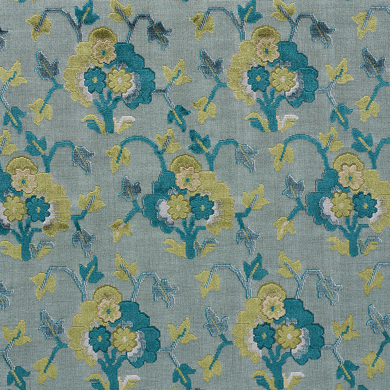 Velvet fabric in peacock and celadon with a cut-and-patterned jacquard motif.