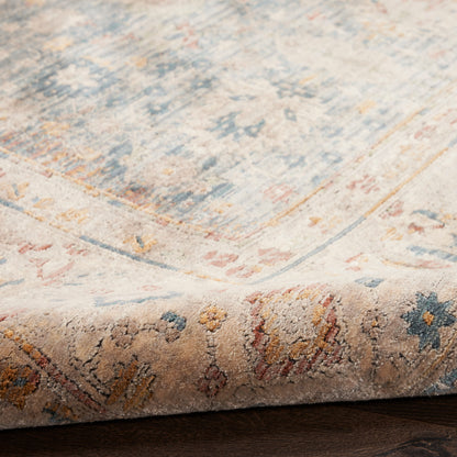 Pastel oriental rug with blue, ivory, peach tones; floral medallion pattern; soft pile, folded edge.
