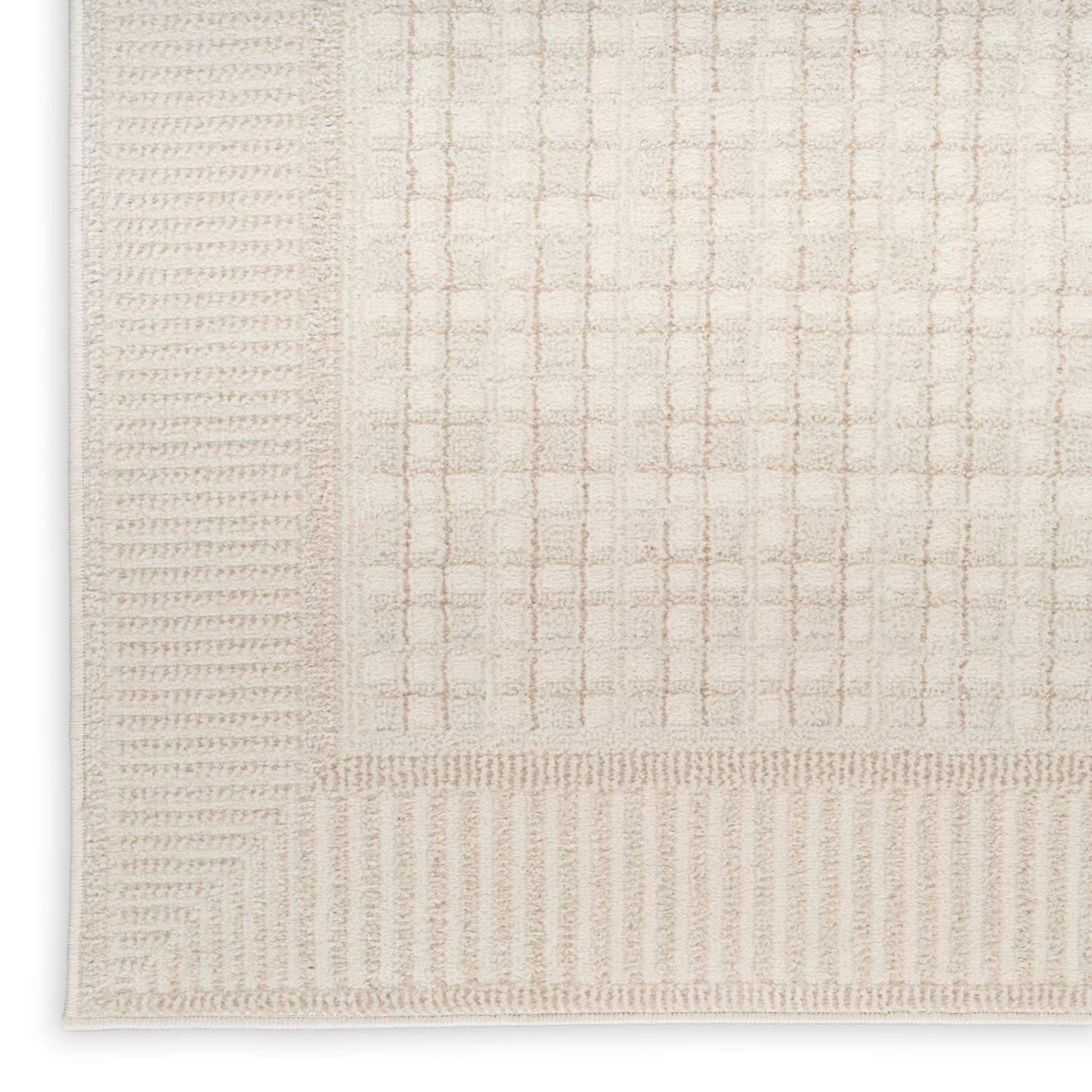 Beige rectangular rug with a soft woven grid pattern and ribbed border, neutral cream color for modern living spaces.